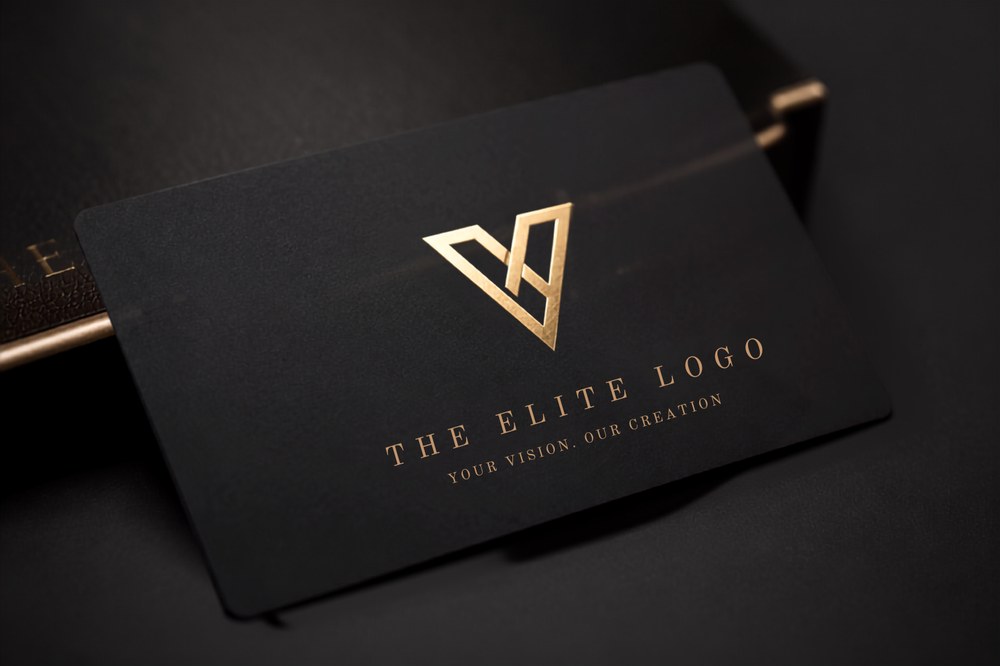 Fintech brand mark on a black business card